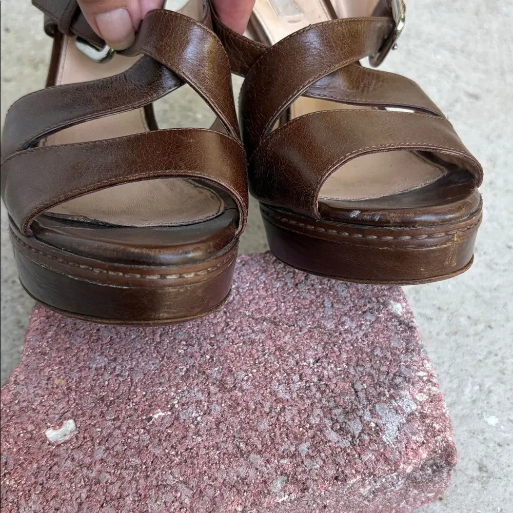 Prada crisscross open toe platforms